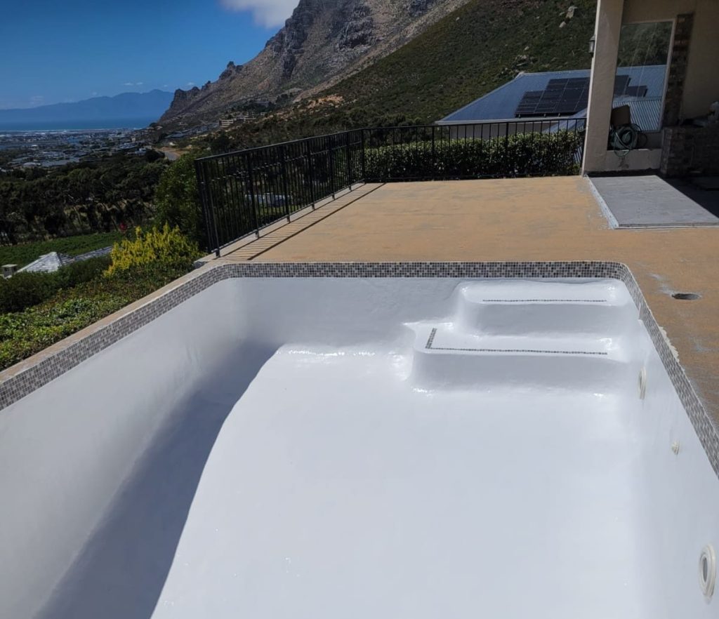 Luxury renovated fibreglass swimming pool in Tulbagh Western Cape surrounded by Winelands mountains and vineyards
