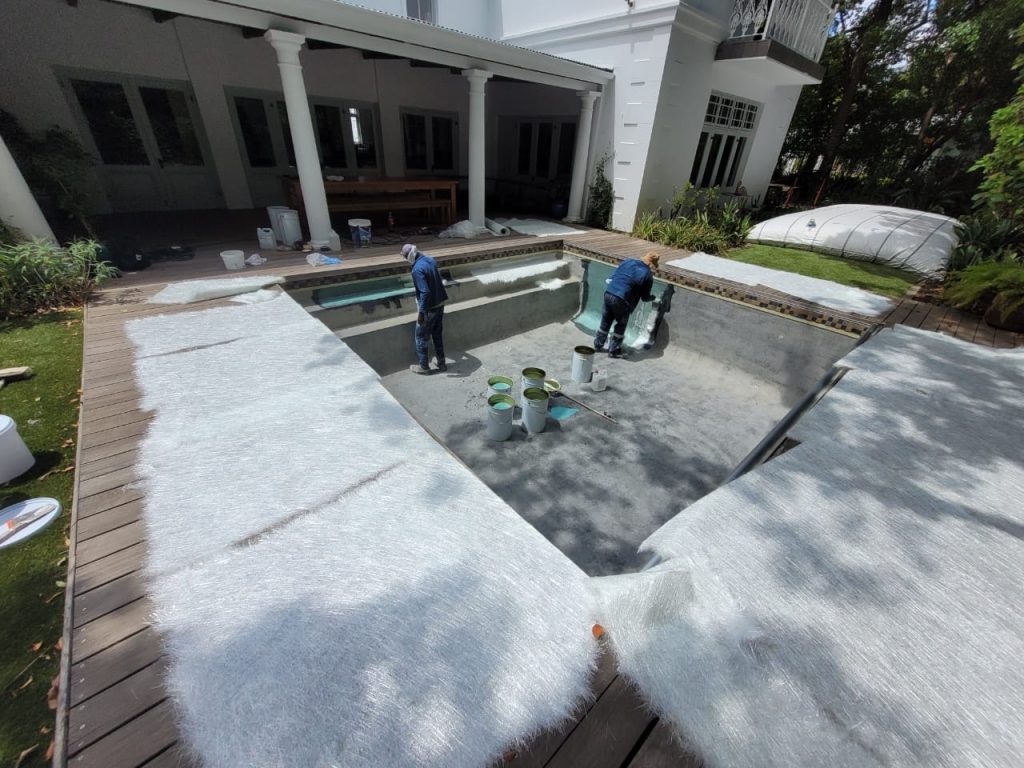 Fibreglass lining installation inside swimming pool during pool renovation in Langebaan