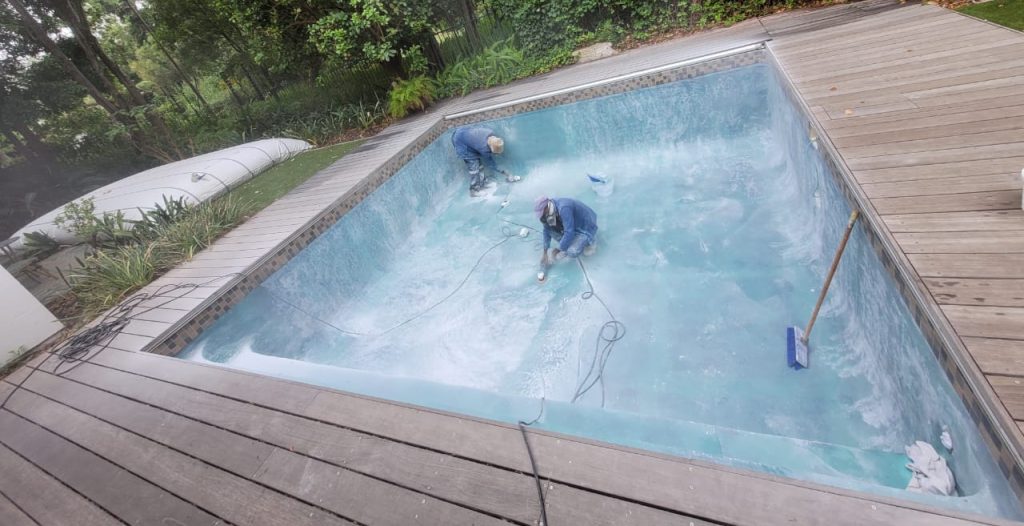 Concrete pool sanding before fibreglass lining