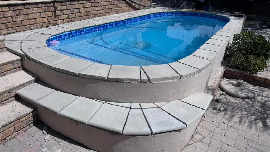 Raised pool with bullnose copings on the top edge and on the step around it